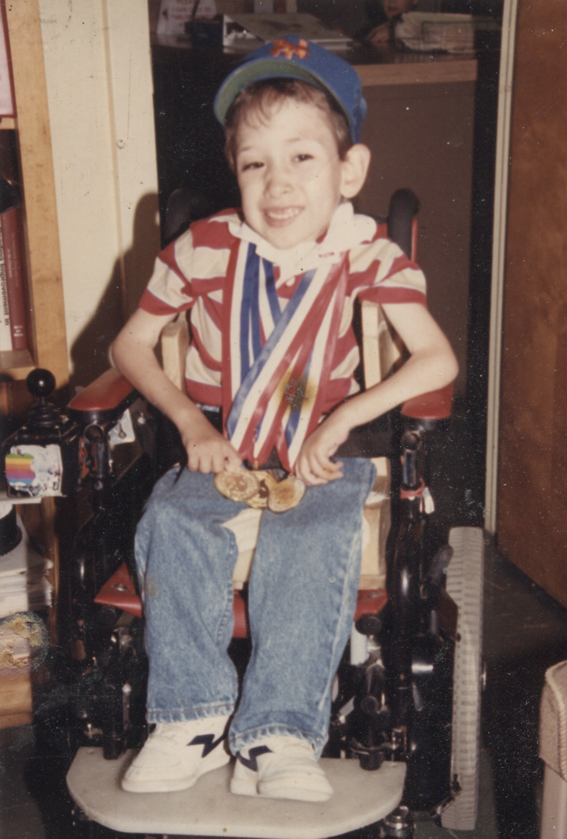 Young Eric with his medals